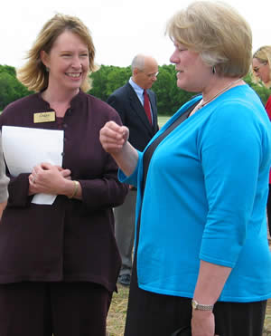  2 women standing outside