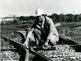 Man inspecting railroad track