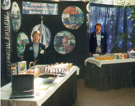 2 women behind display booth