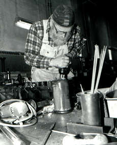 Man repairing truck engine