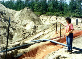 Women in safety vest at work site