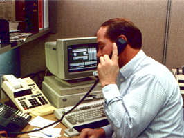 Man on phone at desk