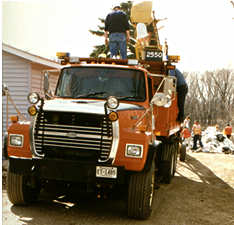 Orange truck loaded with sandbags