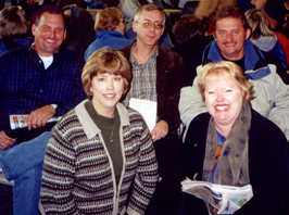 Five people sitting at airport