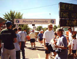 State fair crowd under Moving MN banner