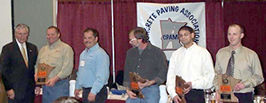 6 men standing holding awards