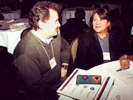 Man, woman sitting at table