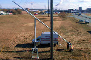 crews hoist pipe