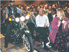 Man on motorcycle in conference room