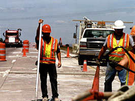 Hwy workers in reflective clothing