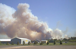 Smoke billows over building