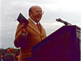 Man at outside lectern