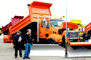 People in front of orange truck