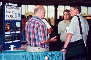 3 men at bike booth