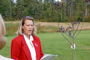 Woman speaking outdoors