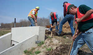 Four men digging