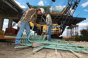 2 men working on bridge