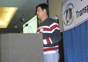 Man speaking at lectern