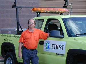 Man standing next to truck