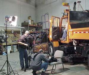 Crew filming inside truck station