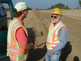 2 men in safety vests