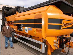 Man in front of orange screener