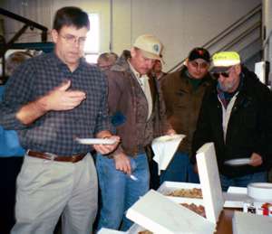 Employees eating pizza