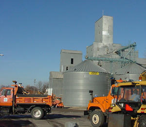 Orange trucks clearing debris