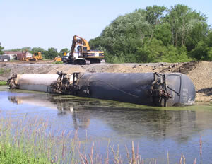 Derailed train car on side in water