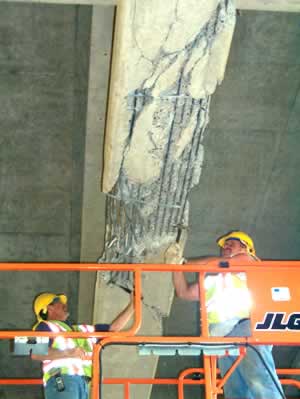 2 men repairing bridge