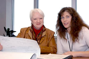 2 women sitting at table