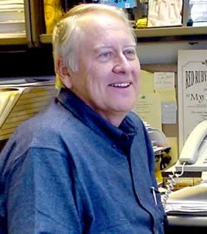 Man smiling at desk