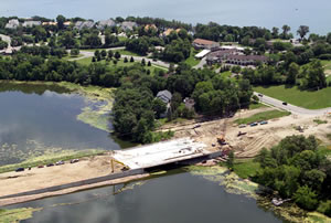 Aerial view of bridge construction over lake