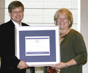 Man, woman holding certificate