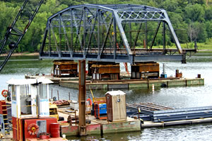 Bridge span floating on barge