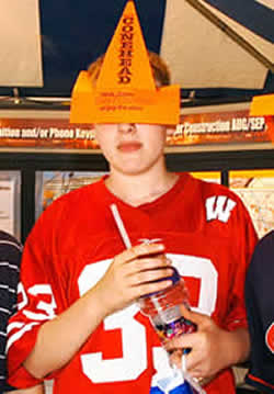 Boy wearing orange "conehead"