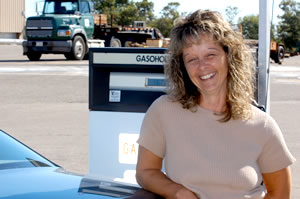 Woman standing near gas pump
