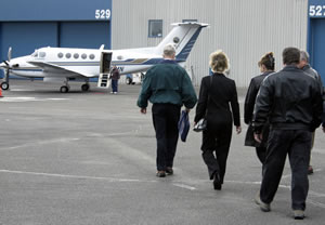People walking toward airplane