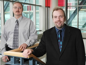 2 men standing in stairwell