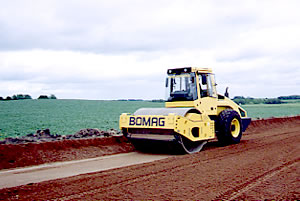 Roller compacting soil