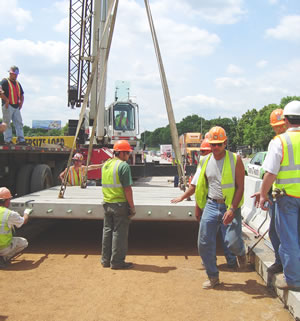 Men placing concrete slab