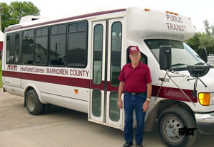 Man standing next to bus