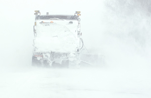 Snowplow obscured by snow