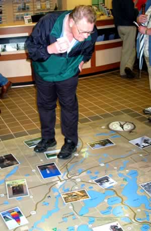 Man looking at map on floor