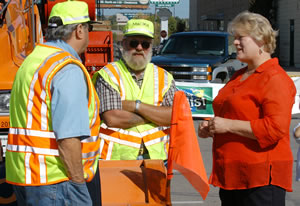 3 people at hwy celebration