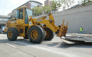 Removing debris from the roadway. 