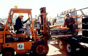 2 men sandbaggin road