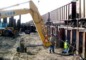 Men working on underpass as train passes