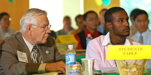 2 men sitting at table