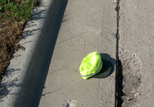 Hat on road near hole in road